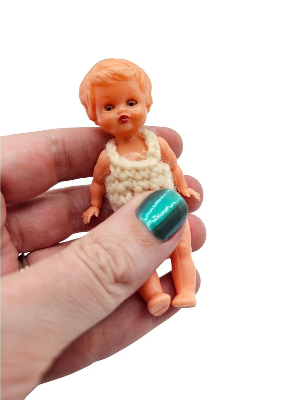 vintage Redbox hard plastic baby doll, likely from the 1950s to early 1980s